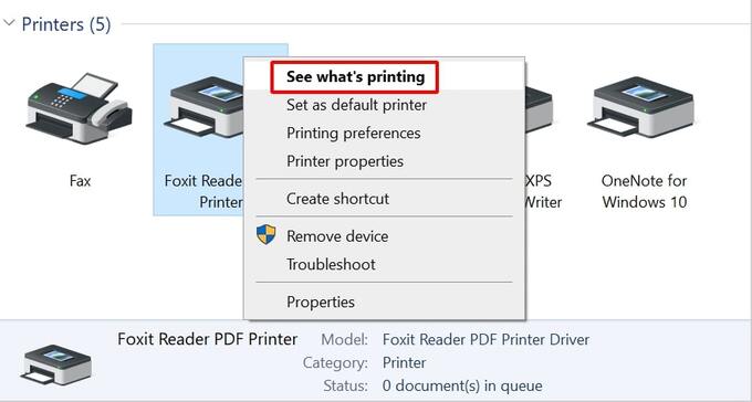 Click chuột phải vào máy in và chọn See what’s printing